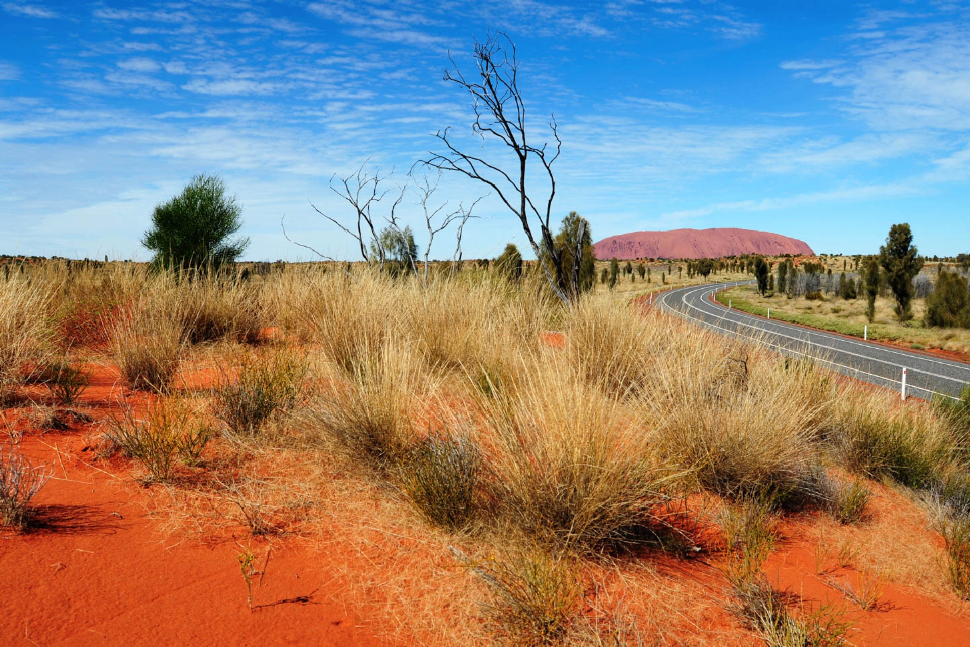 Ayers Rock ändrar färg efter solens gång